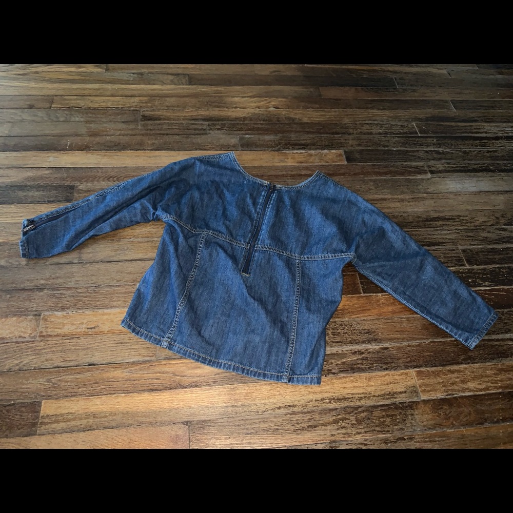 Blue denim shirt with pocket and zipper on sleeve